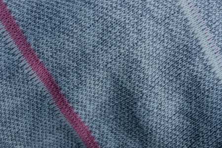 gray woolen fabric texture with red stripe
