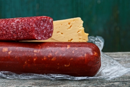 red cheese on a gray wooden table