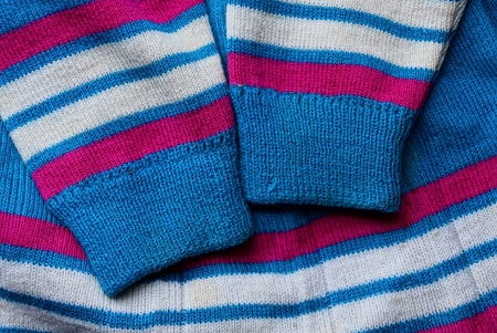 colored striped woven fabric texture with sleevesの写真素材