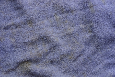 lilac brown dirty cloth background of crumpled piece of matterの写真素材