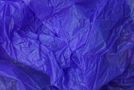 lilac plastic texture from a crumpled piece of cellophaneの写真素材