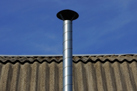 long metal pipe on a gray sky