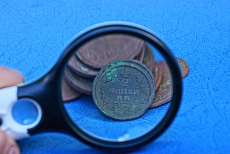 gold coins on a blue table