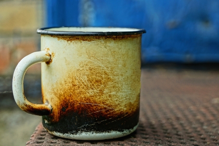 black old metal soot stands on white brown table