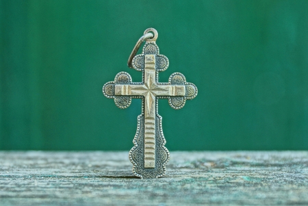 silver cross on white background