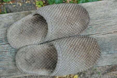 two old gray dirty slipper