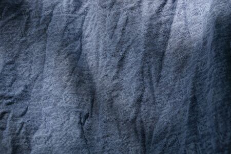 gray cloth texture from a piece of crumpled fabric
