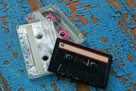 three audio tapes are on the blue board
