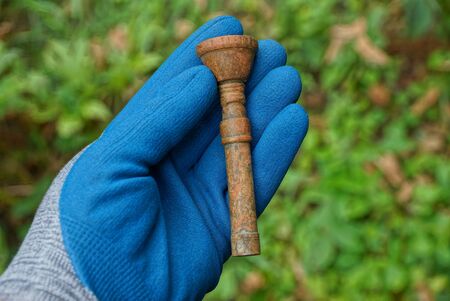 bronze mouthpiece on green backgroundの写真素材