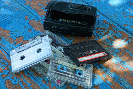 cassette player lying on a worn blue table