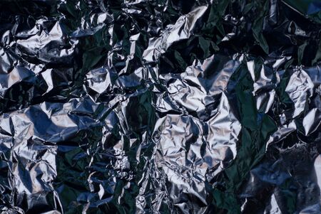 black gray texture from a piece of crumpled old foilの写真素材