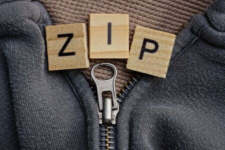 word made of brown wooden letters and metal zipの写真素材