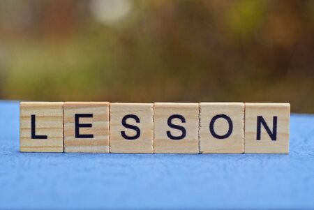 word lesson made from brown wooden lettersの写真素材