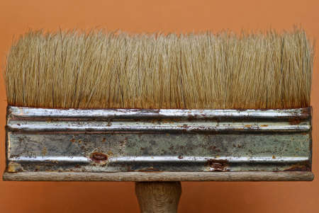 part of one large and clean paint brush on a brown backgroundの写真素材
