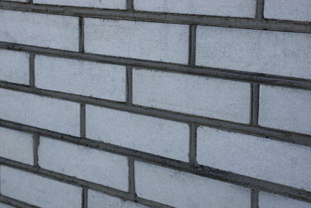 white gray stone texture of bricks in a building wall