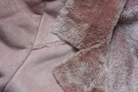 brown suede fabric texture and fur collar on a winter jacketの写真素材