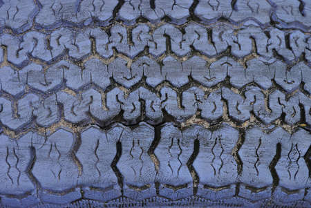 lilac plastic texture from an old dirty car tire with cracks