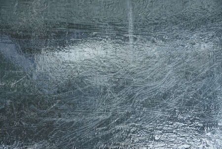 gray black plastic texture from a crumpled piece of cellophaneの写真素材