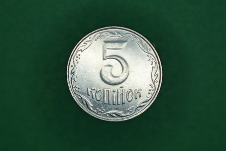 white Ukrainian coin five kopecks on a green backgroundの写真素材