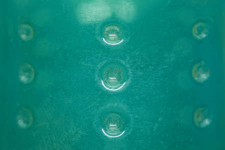 green plastic texture from transparent old shabby bottle