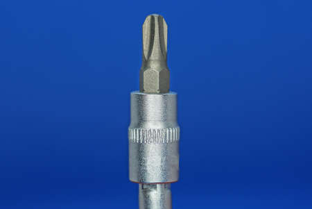 one gray metal adapter with a screwdriver on a blue background