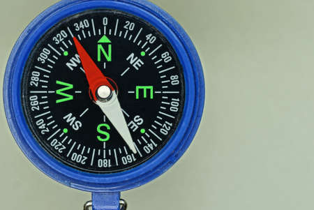 one big open blue plastic tourist compass on gray backgroundの写真素材