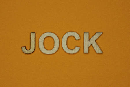 gray word jock made of wooden letters on brown backgroundの写真素材