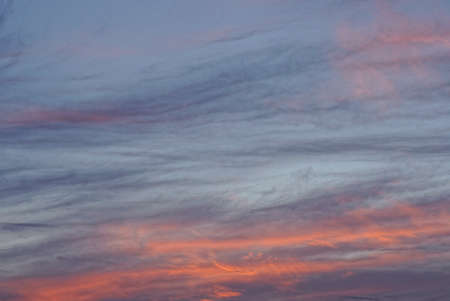 blue evening sky at sunset with gray orange clouds