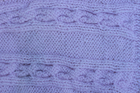 lilac violet texture of fabric made from woolen cloth of clothing with knitted pattern