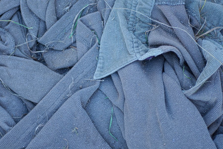 gray dark fabric texture from a piece of dirty matter from old clothes