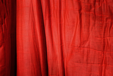red texture from a piece of crumpled fabric on old clothesの写真素材