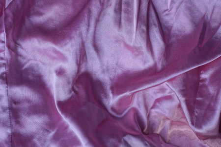 texture of matter of pink from a piece of crumpled clothesの写真素材