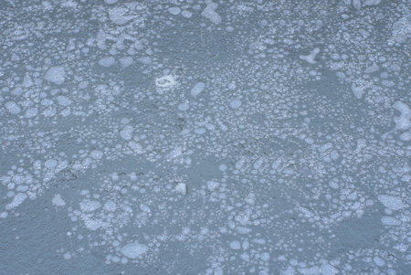 natural gray white texture from ice with bubbles on a frozen winter lake