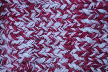 colored texture of woolen red white knitted fabric