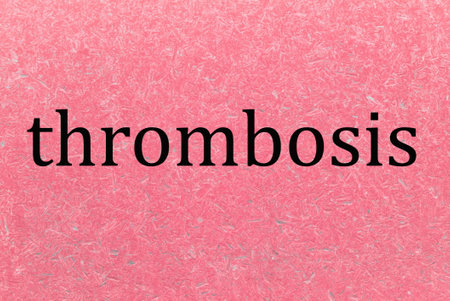 black word thrombosis on red background from illustrationの写真素材