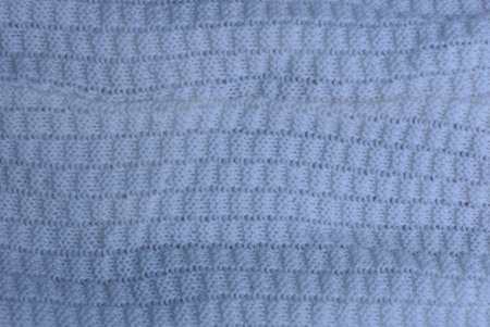 gray white texture of fabric made from woolen cloth of clothing with knitted pattern