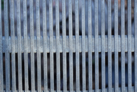 gray texture from an old dirty plastic striped ventilation grateの写真素材