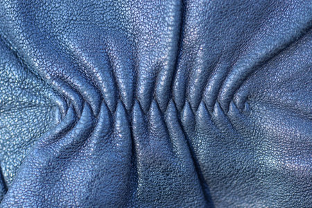 black leather texture of a piece of clothing with a seamの写真素材