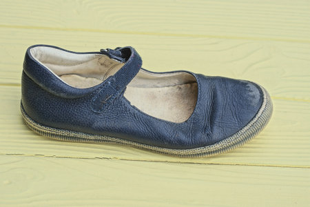 Blue leather shoes on yellow wooden background - vintage effect style picture.の写真素材