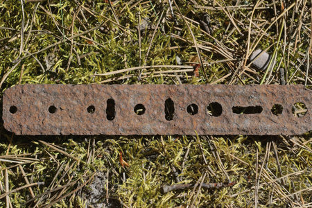 Rusty metal plate with holesの写真素材