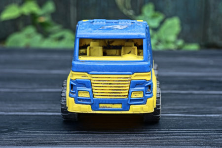 Truck toy on a wooden background. Toy car on a wooden background.の写真素材