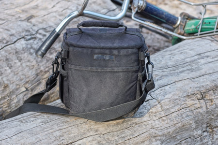 Backpack and bicycle on wooden background. Travel concept. Selective focus.の写真素材