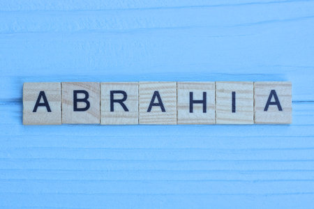 word made of wooden letters on a blue wooden backgroundの写真素材