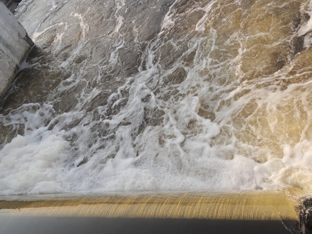 Water flowing from the dam to the river, closeup of photoの写真素材