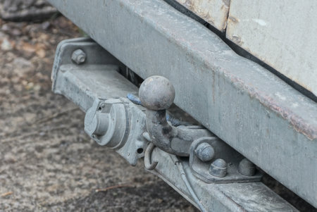 A closeup shot of the handle of an old train with a blurred backgroundの写真素材