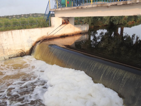 Water flow from the dam to the river, closeup of photoの写真素材