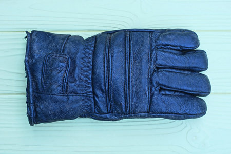 Leather gloves on wood background - Vintage filter effect processing style pictures