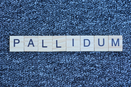 text the word from wooden small letters with black font on an gray tableの写真素材