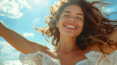 A woman standing with her hair flowing freely in the wind, creating a dynamic and vibrant scene.の素材