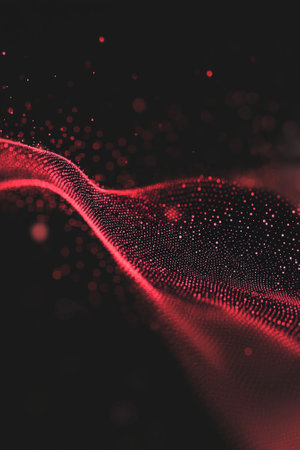 Delicate red particles swirl and float gracefully in a fluid motion, forming captivating patterns against a deep black background, reminiscent of cosmic waves or ethereal beauty.の素材